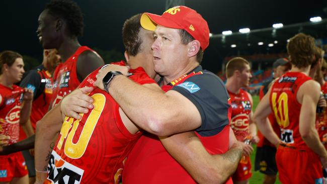 Stuart Dew hugs Joel Jeffrey after Gold Coast’s win against the Bulldogs. Picture: Michael Willson/AFL Photos via Getty Images