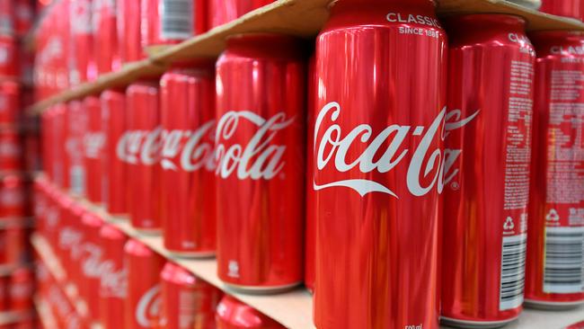 Cans of coke are seen at the Coca Cola factory in Melbourne, Tuesday, February 25, 2020. Andrews has announced a $96.5mil package to improve Victoria's recycling industry. (AAP Image/James Ross) NO ARCHIVING