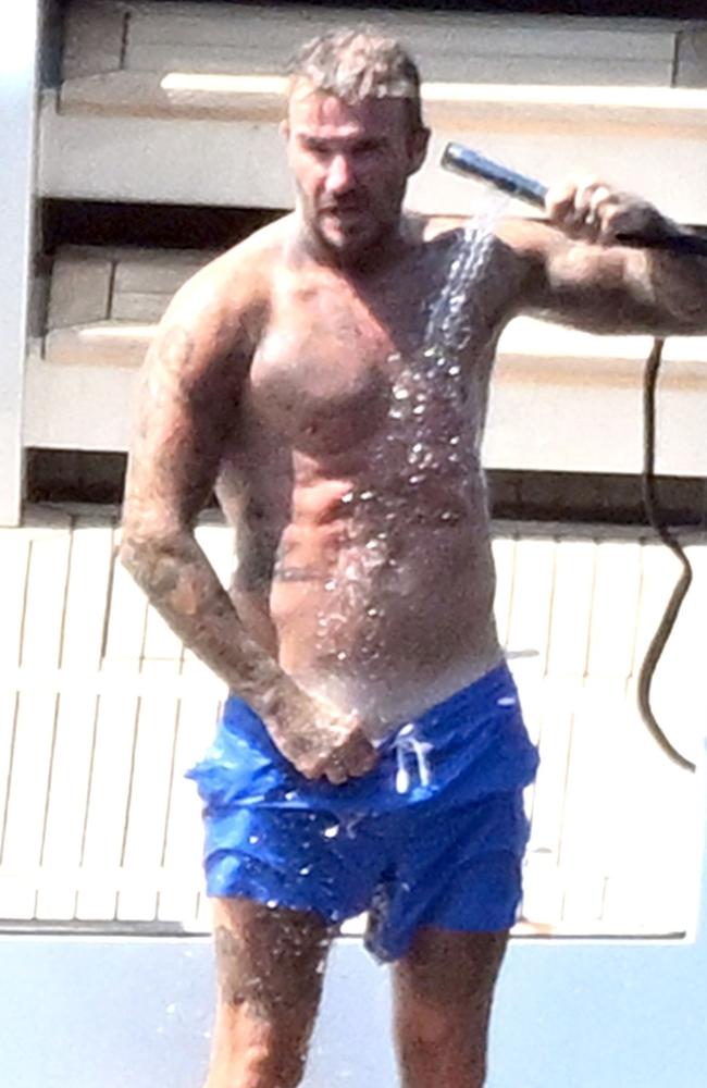 David Beckham was seen showering after taking a dip in the Mediterranean Sea. Picture: Backgrid.