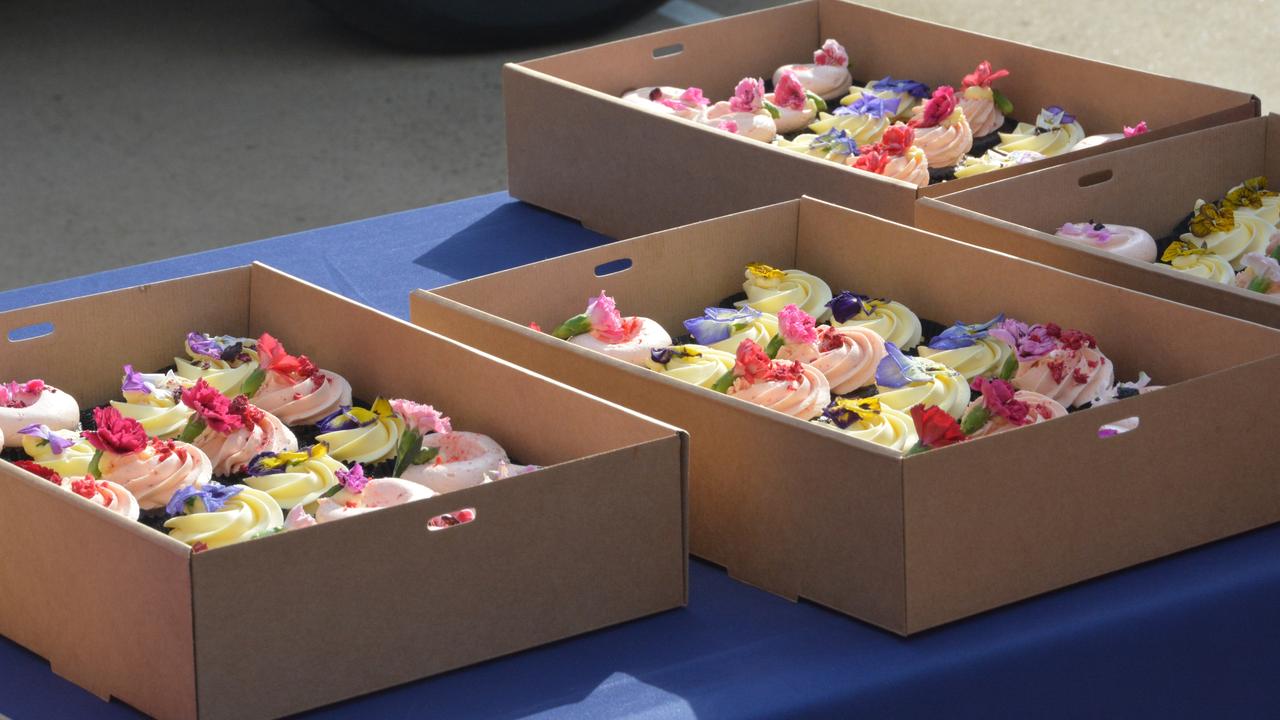 To celebrate the end of the Toowoomba Carnival of Flowers 2023 and reveal the theme of the 75th anniversary next year, the Toowoomba Regional Council and event sponsor Peter Robert Honda gave away 75 cupcakes with special prizes. Picture: Rhylea Millar