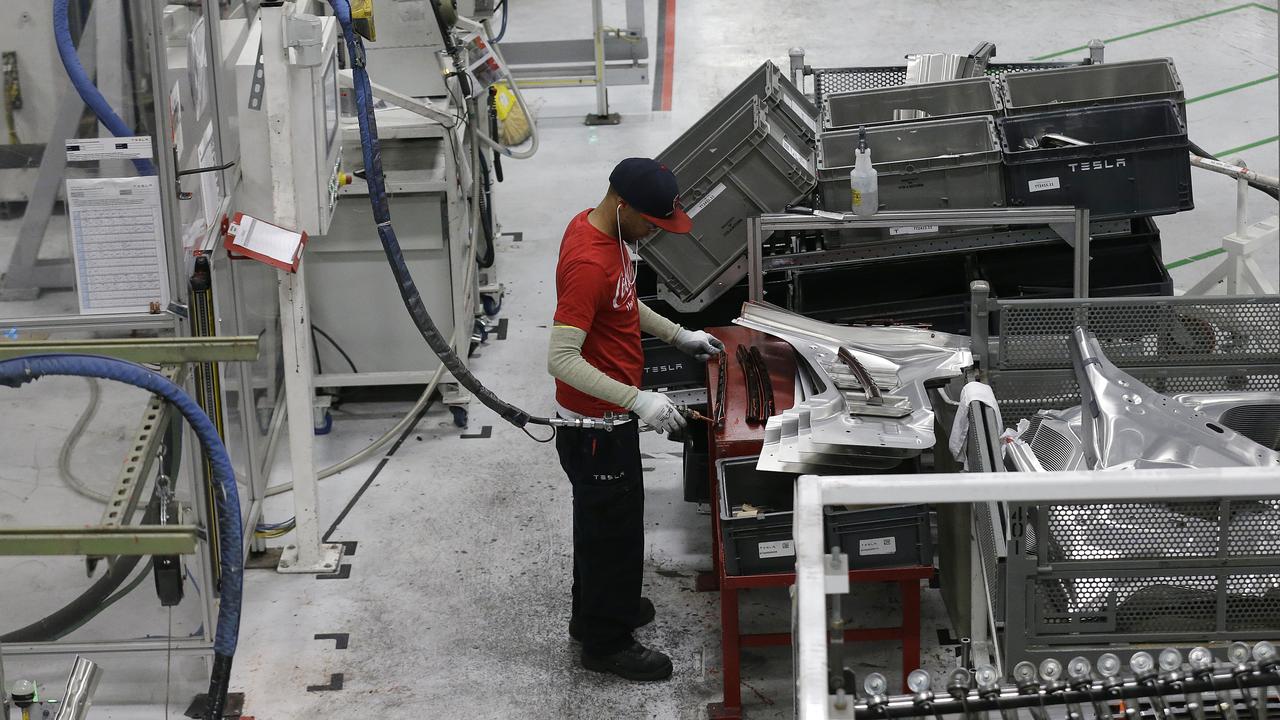 A Tesla employee at the factory in 2015. Picture: Jeff Chiu/AP