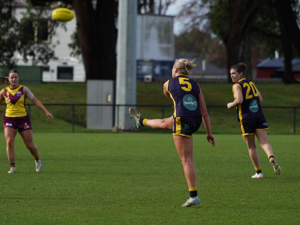 SFL's Grace White kicks one of her three goals in the 2025 Tasmanian Representative Series match against NWFL at Dial Park. Picture: Joeb Dedman.