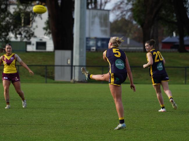 SFL's Grace White kicks one of her three goals in the 2025 Tasmanian Representative Series match against NWFL at Dial Park. Picture: Joeb Dedman.