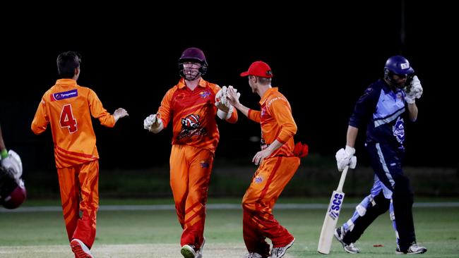 Barrier Reef Big Bash Game 1: Badgers v Hurricanes at Griffiths Park. Badgers' Aidan Beach, Angus Warnock and Daniel Freebody celebrate the wicket of Hurricanes' Mark Ellis. Picture: Stewart McLean