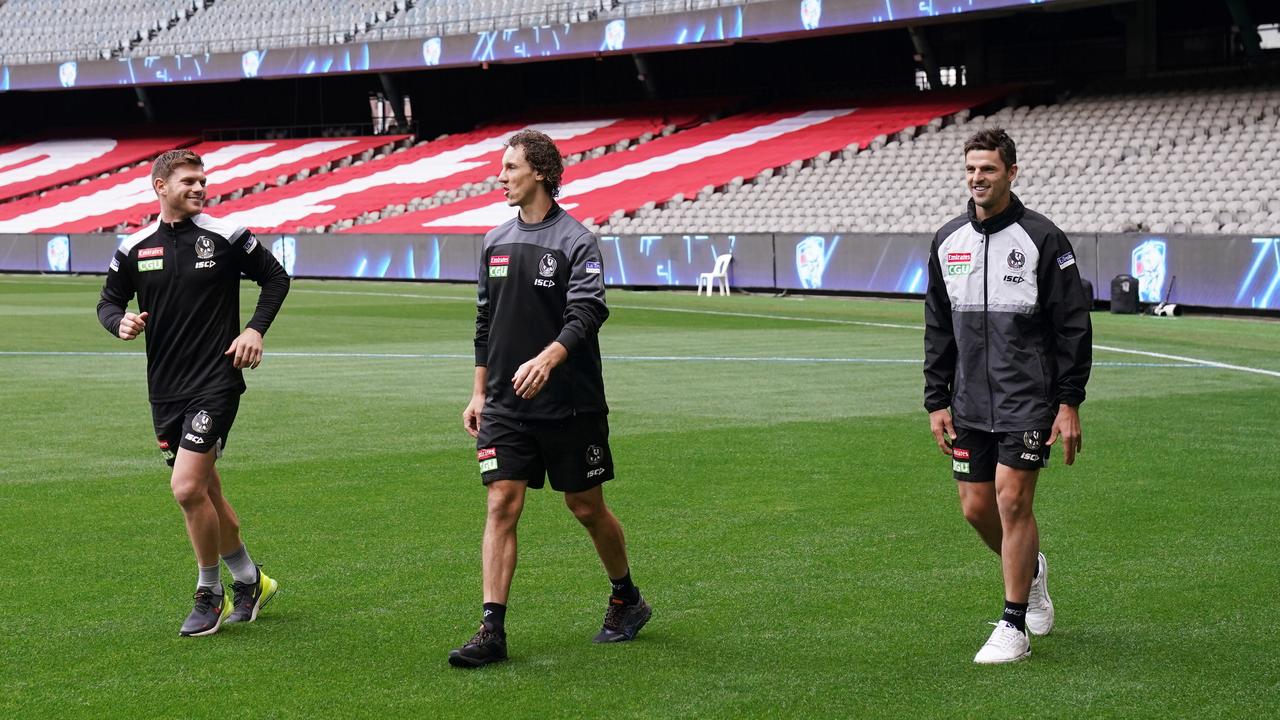 Taylor Adams, Chris Mayne and Scott Pendlebury won’t sing Collingwood’s theme song if they beat the Western Bulldogs. Picture: Michael Dodge