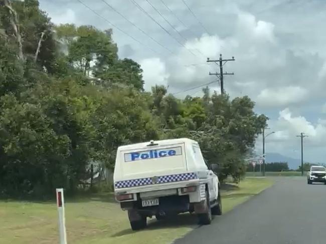 A police vehicle on Martyville Rd, Martyville - south of Innisfail where a man in his 20s was found dead on December 25. Picture: Supplied