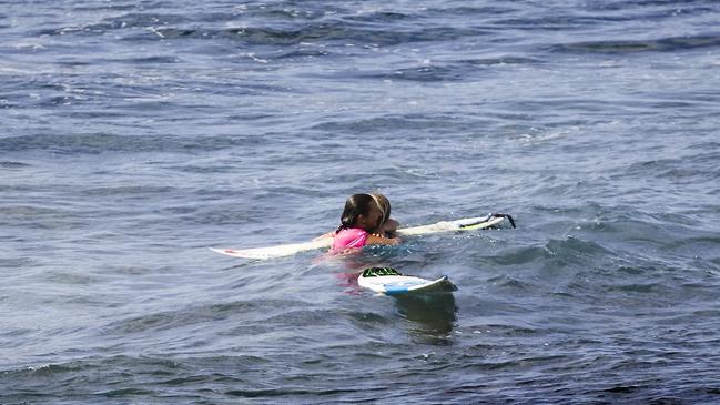 Layne Beachley and Stephanie Gilmore embrace following Layne's final world surfing event in Hawaii in 2008. Picture: ASP/Cestari@Covered Images.