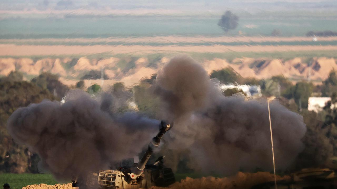 A shockwave is visible as an Israeli army self-propelled artillery fires a round from southern Israel toward the Gaza Strip on February 1, 2024. Picture: JACK GUEZ / AFP