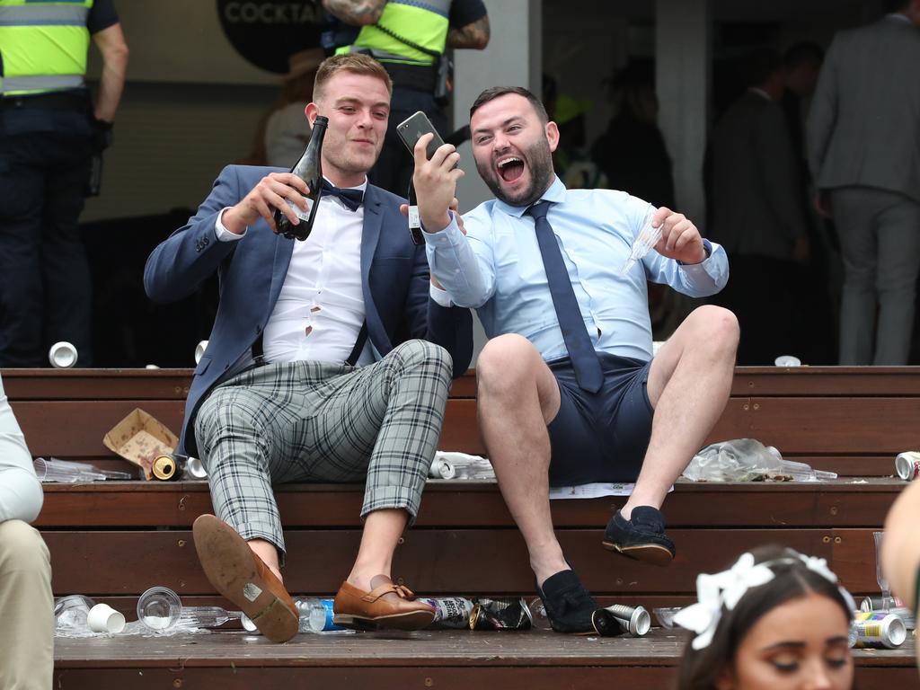 Racegoers are seen at the end of the Lexus Melbourne Cup Day, as part of the Melbourne Cup Carnival, at Flemington Racecourse in Melbourne, Tuesday, November 6, 2018. (AAP Image/Dave Crosling) NO ARCHIVING, EDITORIAL USE ONLY