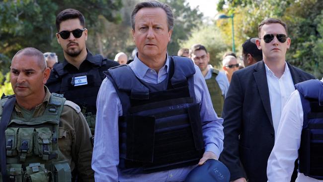 British Foreign Secretary David Cameron during a visit to Kibbutz Beeri.