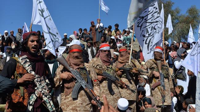 Afghan Taliban militants and villagers celebrate the peace deal in Laghman province . Picture: AFP