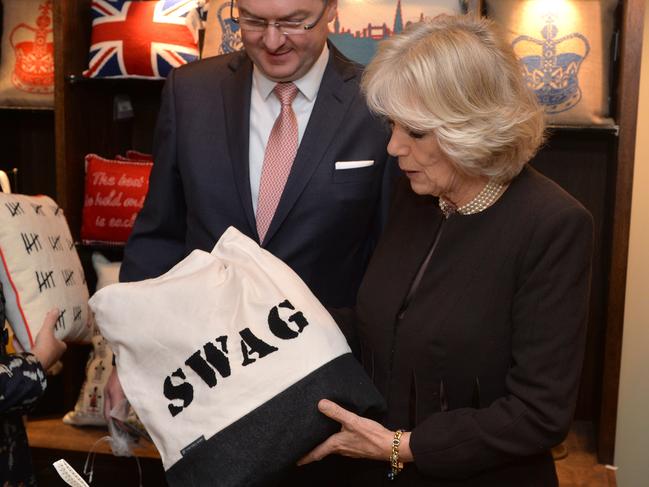 LONDON, ENGLAND - DECEMBER 03:  Camilla, Duchess of Cornwall with Ewan Venters, CEO for Fortnum & Mason during the opening of the 'Fine Cell Work' Pop-up shop at Fortnum & Mason on December 3, 2014 in London, England.  (Photo by Anthony Harvey - WPA Pool/Getty Images)