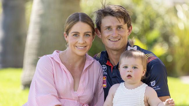 27,February, 2024:   Matt Crouch with finance Ellie Symons and daughter Ava. Matt Crouch to become Crows life member at Adelaide season launch. Picture: Kelly Barnes