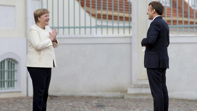 Angela Merkel, left, welcomes Emmanuel Macron at the German government's guest house Meseberg Castle in Gransee near Berlin, Germany. Picture: AP