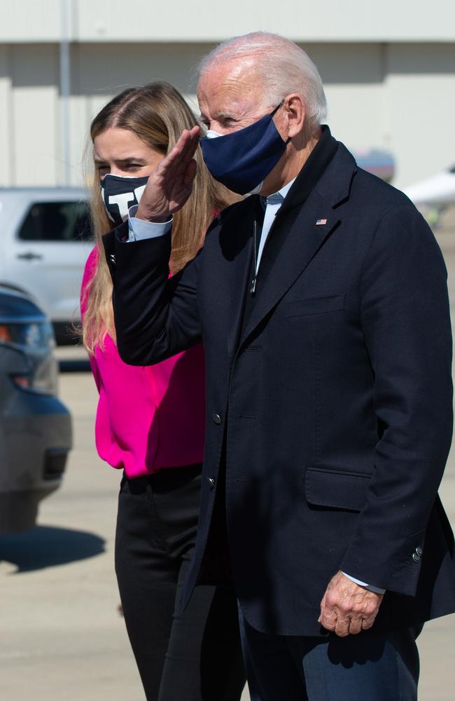 Democratic presidential nominee Joe Biden, right, with his granddaughter Finnegan after landing at the Raleigh-Durham International Airport in Durham, North Carolina. Picture: AFP