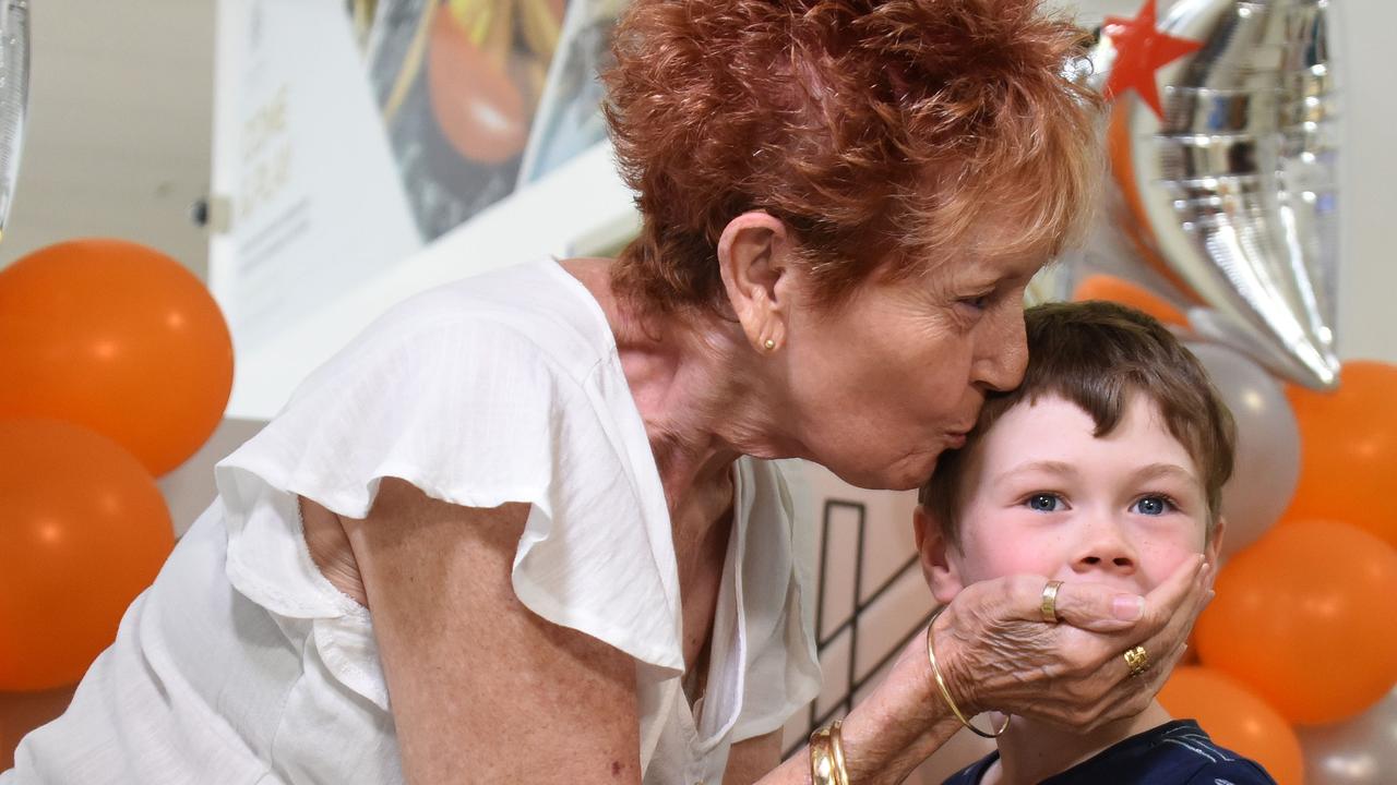 Patrick Conway and godmother Delree Bock reunite after the first flight from Melbourne landed at Gold Coast Airport in Coolangatta. Picture: NCA NewsWire / Steve Holland