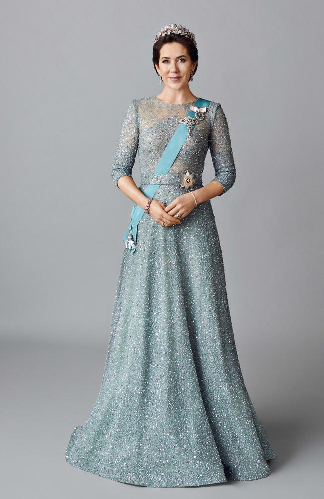 The portraits show Princess Mary in a shimmering blue gown. Picture Hasse Nielsen