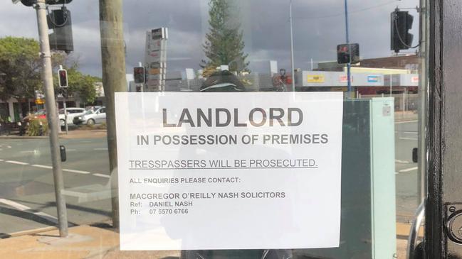 A sign posted on the window of Lester and Earl and Mr Buttergoods in Palm Beach stating the premises are "under landlord possession".