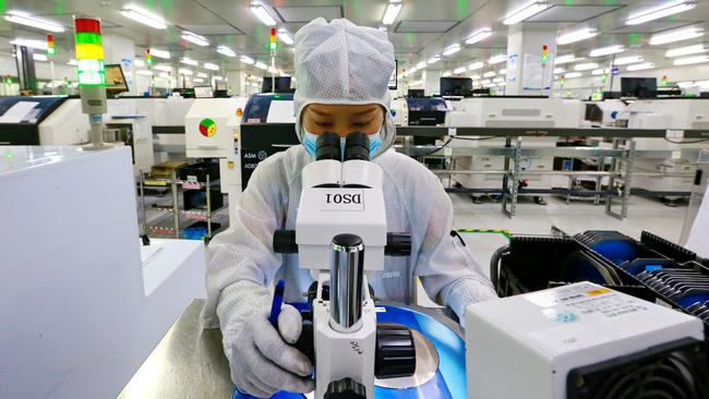 A worker pictured at a semiconductor manufacturer in Suining in Sichuan province before the shutdown. Picture: Zhong Min/Feature China/Future Publishing via Getty Images