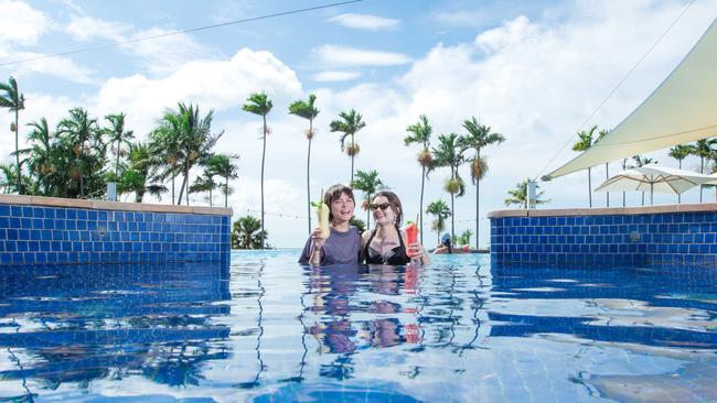 Sisters, Matisse (L) and Breanna Gabbert enjoying cocktails at the Middle Beach Casino Infinity Pool. Picture GLENN CAMPBELL