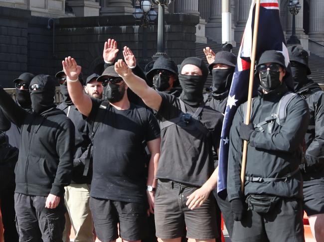 neo-Nazi protesters opted to dress in black and shield their faces. Picture: David Crosling