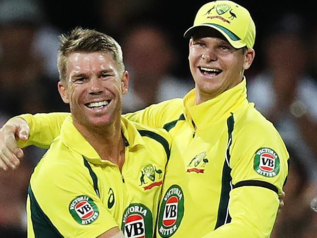 Australia's David Warner celebrates with Steve Smith after taking a catch to dismiss Pakistan's Shoaib Malik off the bowling of Australia's Travis Head during the One Day International cricket match between Australia and Pakistan at the SCG. Picture: Brett Costello