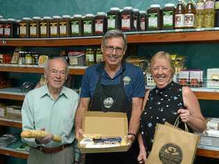 FROMMAGE FRIENDS: John Rasch of Adelaide, John Evans of Rockhampton Fine Foods and Susan Hagan say 'cheese' at Rockhampton Fine Foods. Picture: Jann Houley