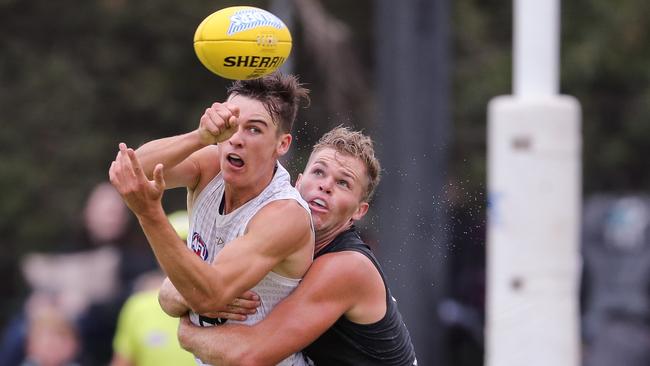 Connor Rozee, being tackled by Dan Houston, fires out a handpass during Port Adelaide’s intra-club match. Picture: Matt Turner/AFL Photos