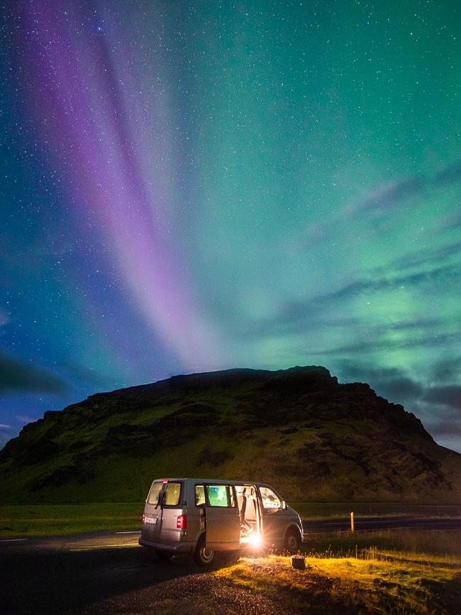 Campervan under the Northern Lights in Iceland.