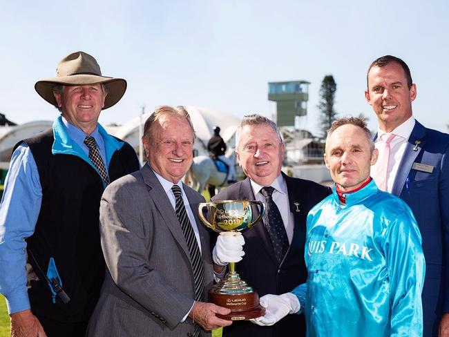 Geoff Lane (second from the left) with Gold Coast racing officials, including Ian Brown (far right) and the Melbourne Cup. Picture: Supplied.