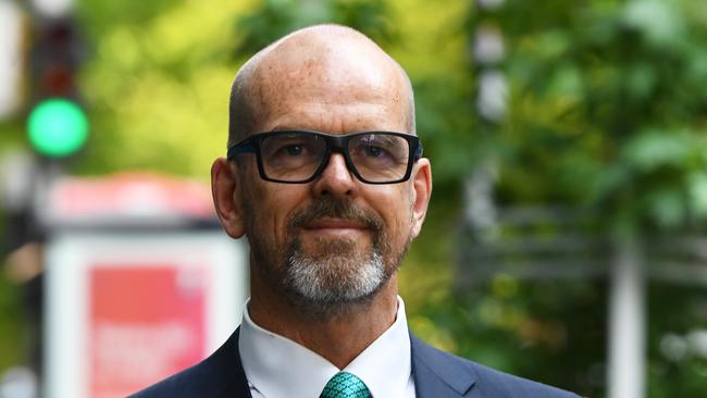 Former Victoria Police chief commissioner Simon Overland arrives at the royal commission at the Fair Work Commission in Melbourne on Tuesday. Picture: AAP