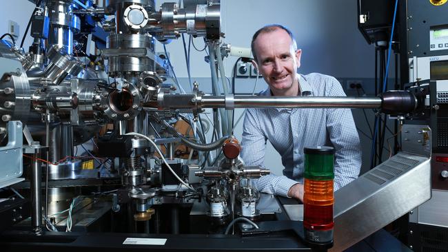 Dr Miles Apperley with an atom probe at a Sydney University lab. Picture: Britta Campion.