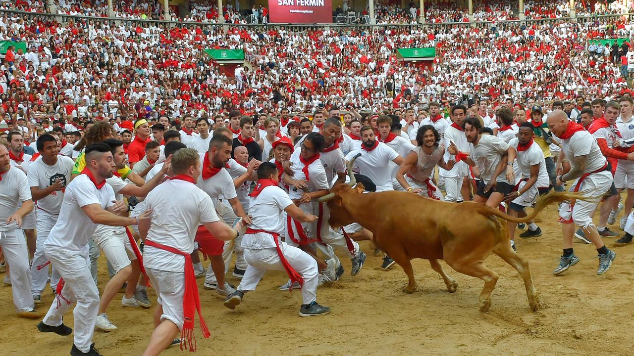 After running the 850m course through Pamplona’s streets, runners and bulls play chicken in the town’s bullring. Photo: Ander Gillenua/AFP