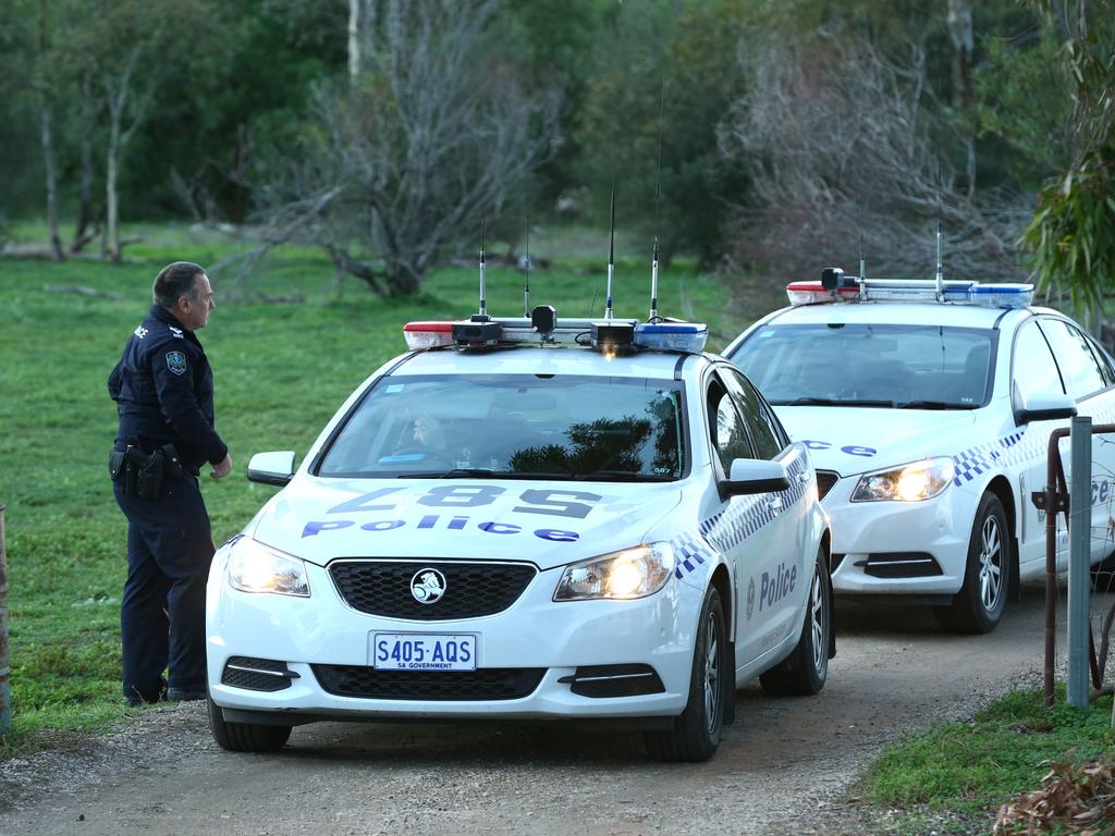 Police investigating the murder, a day after the bodies were found. Picture: Tait Schmaal