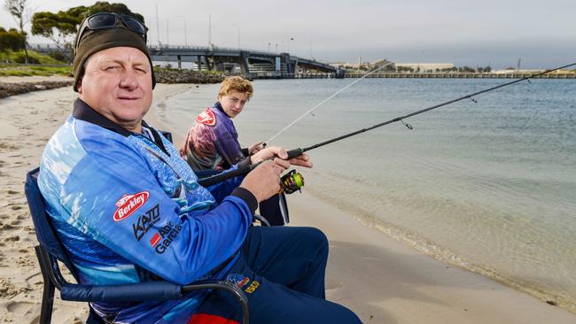 Tim and Ryan Johnson fishing at the Port River. Picture: Brenton Edwards