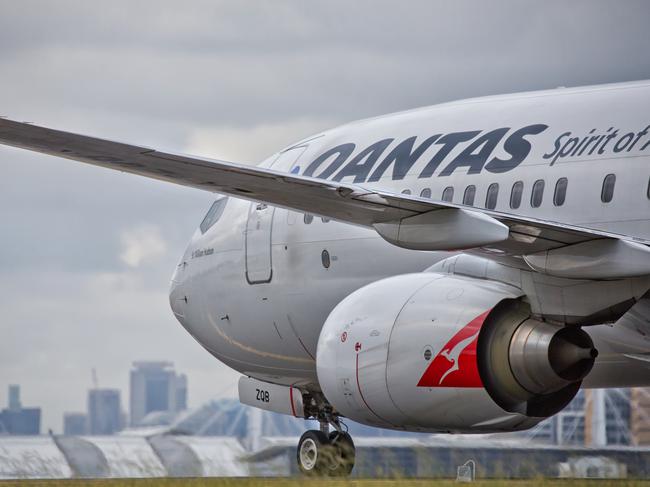 Sydney,Australia - February 20, 2016: A QANTAS Boeing 737 taxies towards the terminal after landing at the city's airport. QANTAS is the flag carrier for Australia.