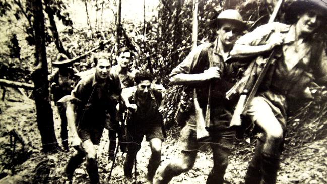 Diggers on the Kokoda Track in 1942. Officers had to prevent Australian and American troops from killing striking trade unionists after wharfies smashed equipment they were meant to load for our soldiers operating in New Guinea and the Pacific Islands. Picture: Damien Parer