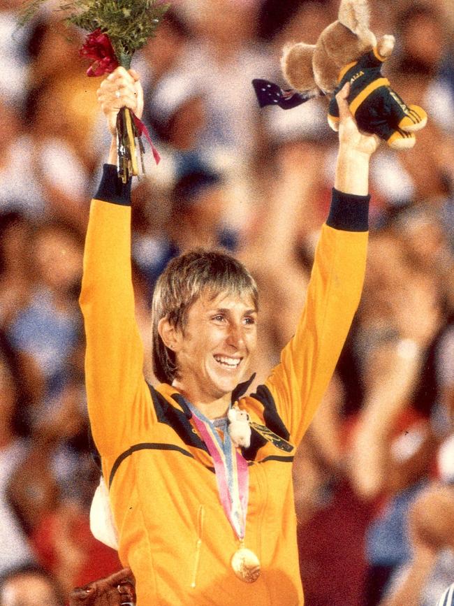 Athlete Glynis Nunn on dais winning gold medal after competing in Heptathlon event at 1984 Olympics in Los Angeles.