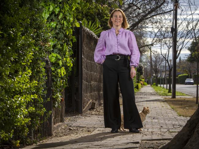 ADELAIDE, AUSTRALIA - Advertiser Photos SEPTEMBER 7, 2022:  Jane Burton and Fred the cat outside her family home at 16 Avenel Gardens Rd in Medindie, SA.. Photographer Emma Brasier