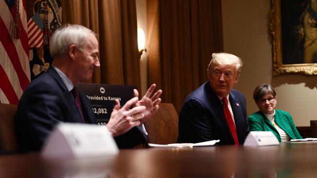 Asa Hutchinson, left, says the Senate trial of Donald Trump is going to force all Republicans to take a clear position. Picture: AFP