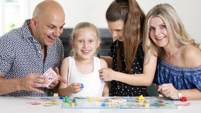 Lendol and Krystina Muftar at home with their children, Madelyn, 8, and Kaitlin, 11. Picture: Sarah Matray