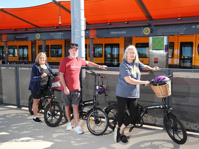 Shirley Scott, Keith Bazley and Jan Charman at Helensvale tram station with their bikes. Picture: Glenn Hampson.