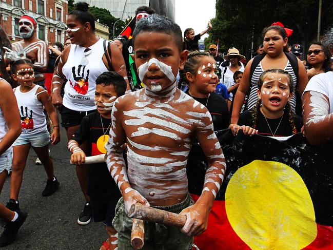 Protesters are seen at an Invasion Day Rally in Redfern, Sydney, Friday, January 26, 2018. (AAP Image/Danny Casey)