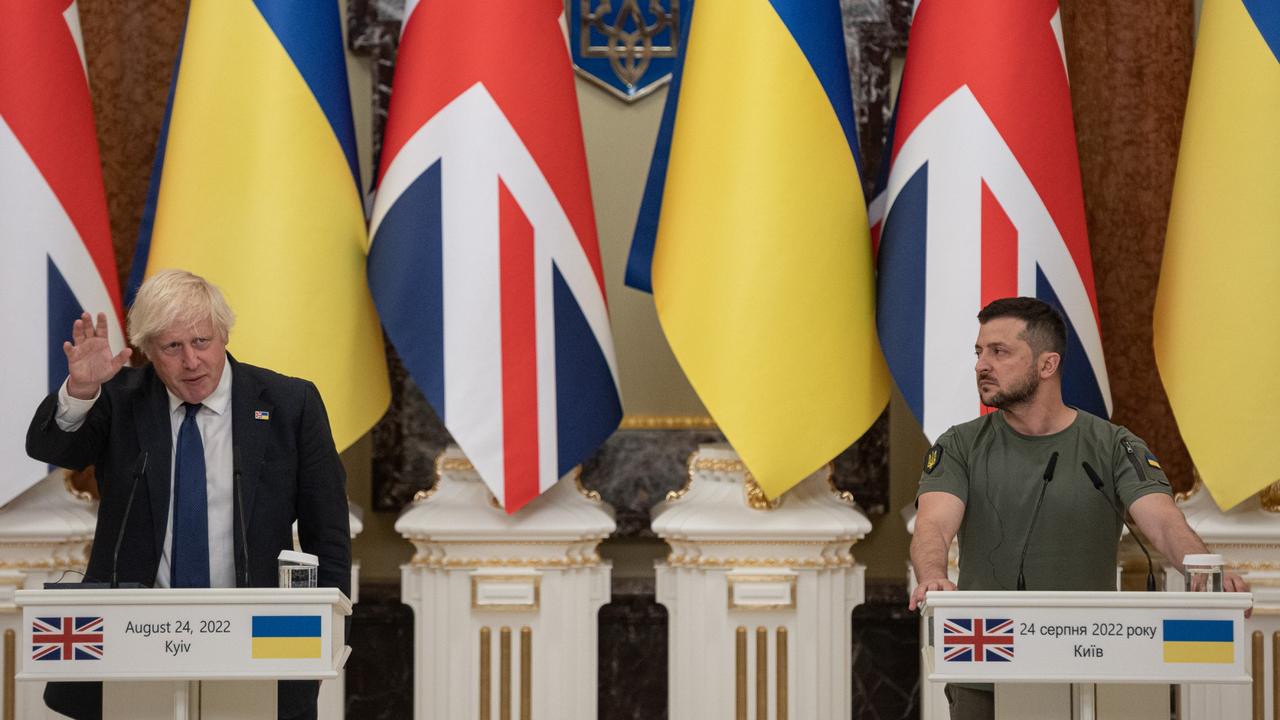 Ukrainian President Volodymyr Zelensky (R) listens to British Prime Minister Boris Johnson as they give a press conference in Kyiv. the UK has aiding the Ukrainian resistance £3.8 billion ($6.454 billion Australian). (Photo by Alexey Furman/Getty Images)