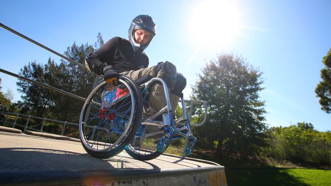 Tim Lachlan mentors younger children who are confined to wheelchairs.