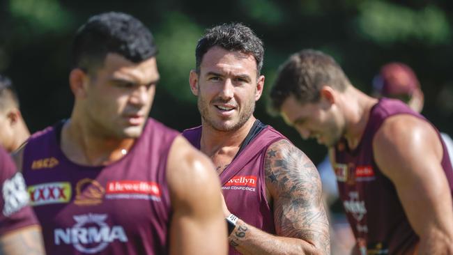 Darius Boyd keeps a close watch on in-demand teammate David Fifita at Broncos training. Picture: AAP Image/Glenn Hunt