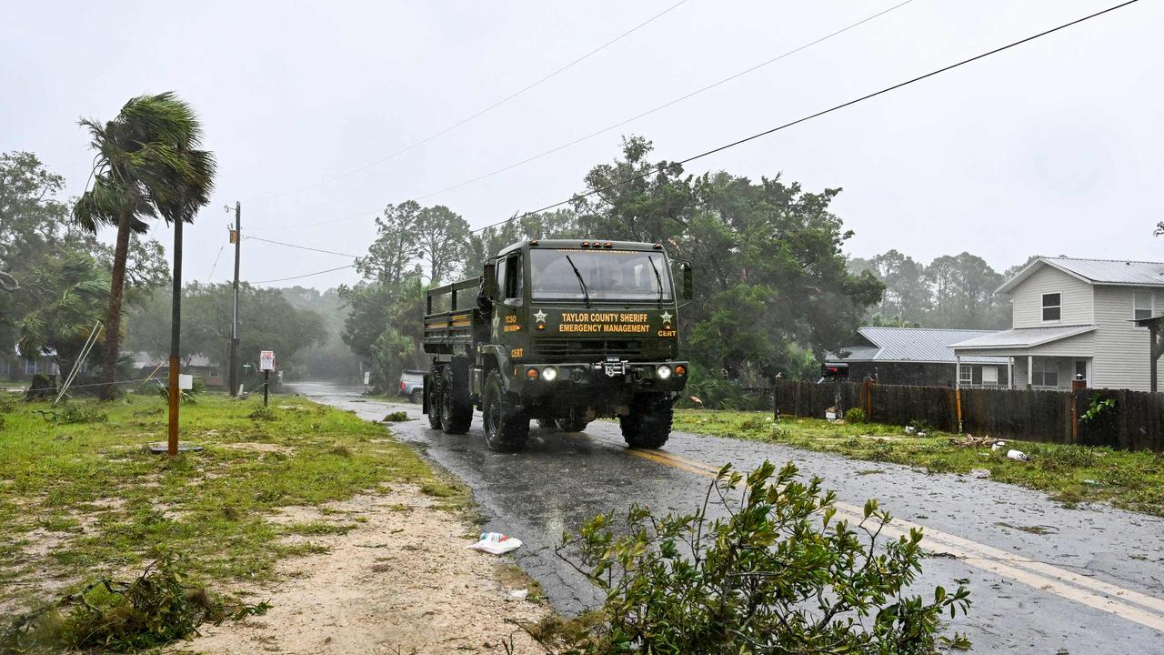 County Sheriff patrol the street in Steinhatchee, Florida on August 30, 2023, after Hurricane Idalia made landfall. (Photo by CHANDAN KHANNA / AFP)