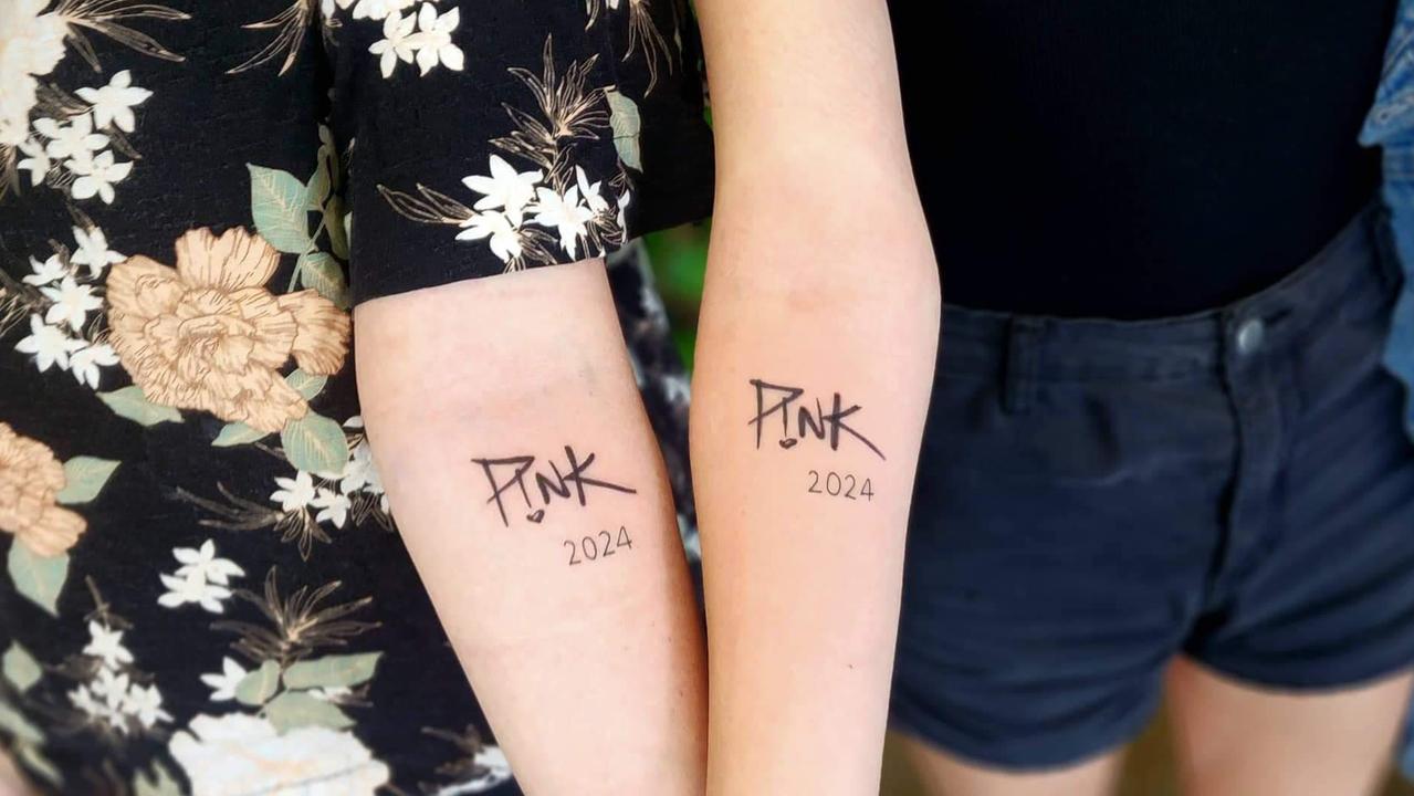 Friends Kira Collins and Thea Schlencker got matching Pink tattoos ahead of her Townsville show. Picture: Supplied