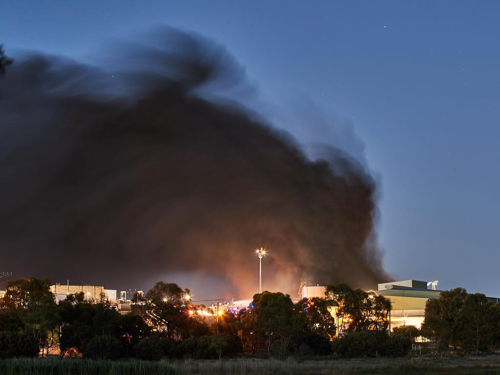 Smoke rises into the air during a fire at the Thomas Foods International meatworks in Murray Bridge. Picture: AAP / Matt Loxton