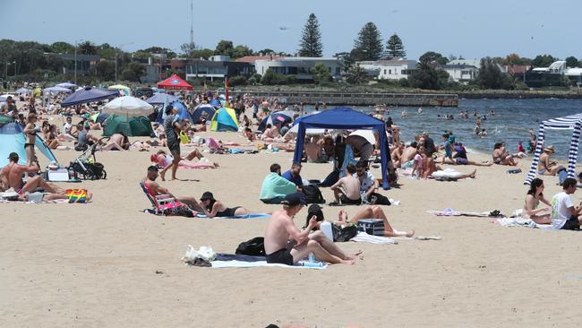 Melburnians are seen packed at a beach as the mercury soars. Picture: NCA NewsWire / David Crosling